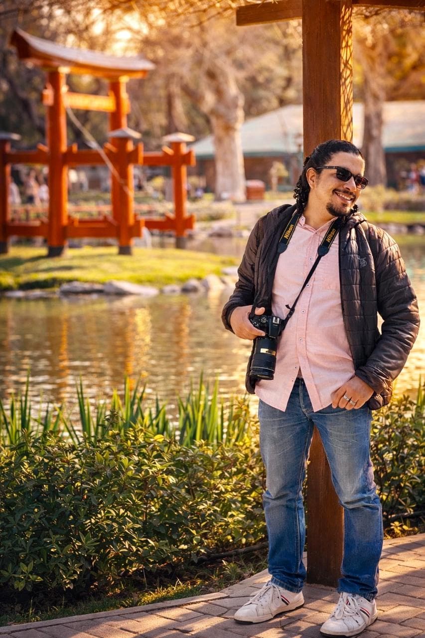 Raynel Lopez holding his camera